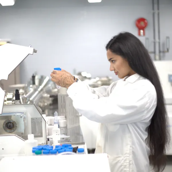 Trent University student conducting research in lab.