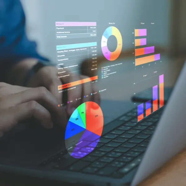 Business person looking at data Analysis and Data Management System, and chats on laptop.