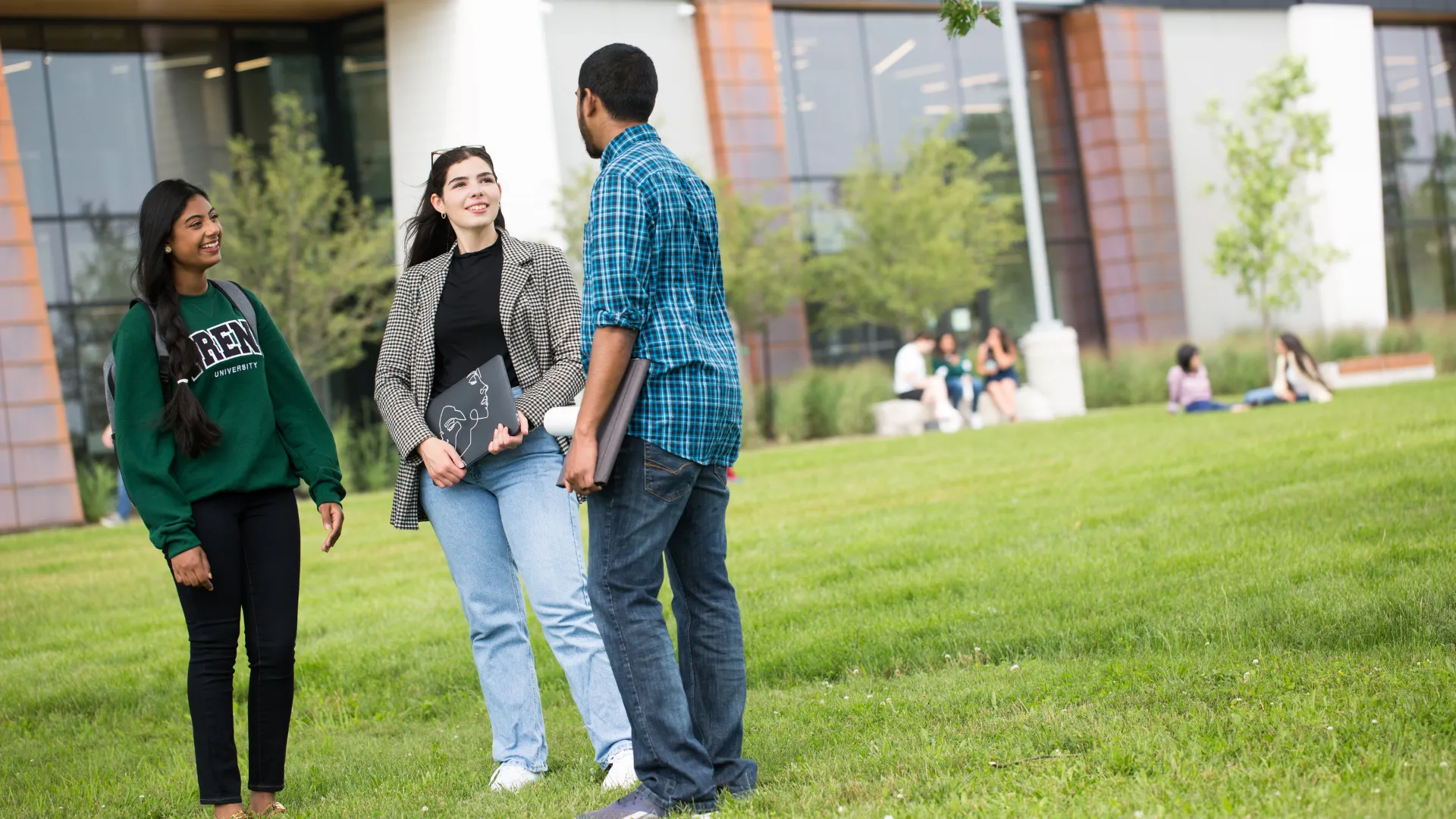 Three Trent students talk outside of the Durham GTA campus