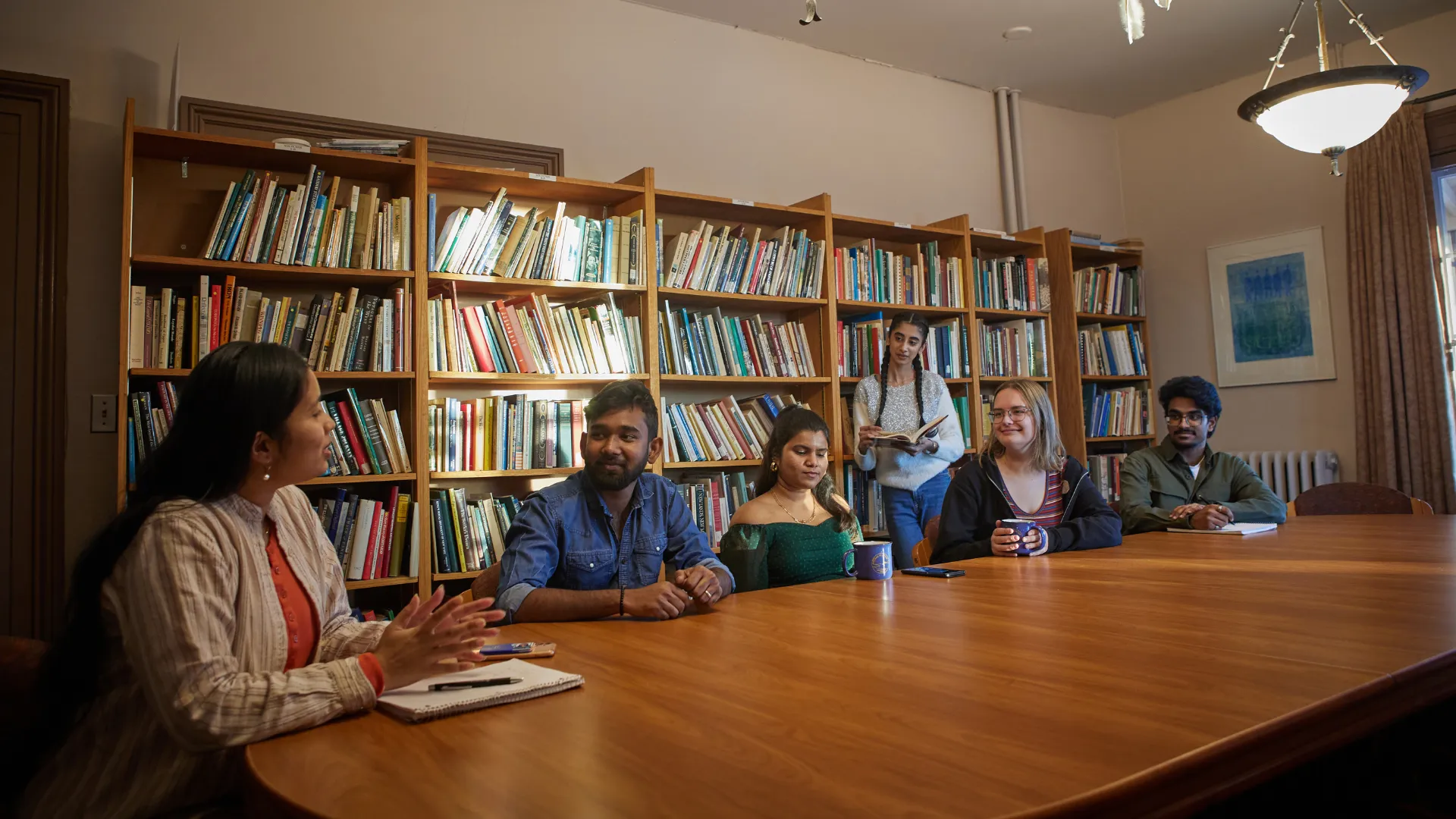 Trent students in a seminar room discussing course materials