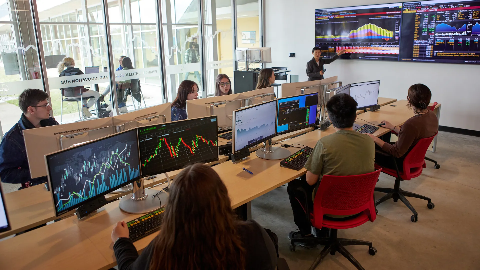 Students in a financial lab listening to the professor