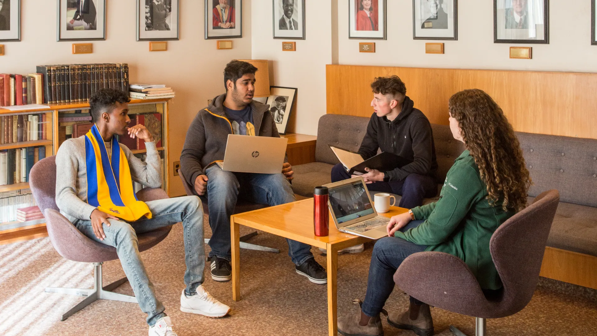 Trent students discussing course materials in the LEC common room