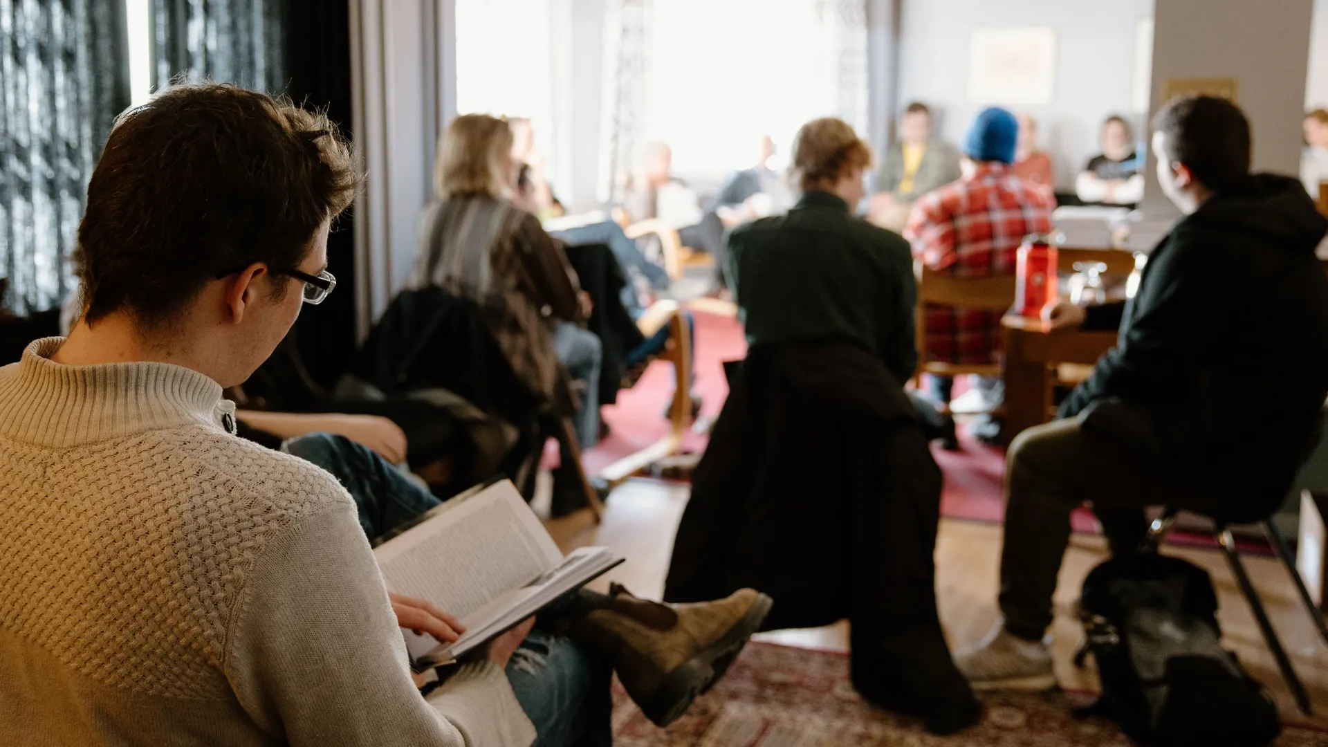 Trent students read while listening to a book reading