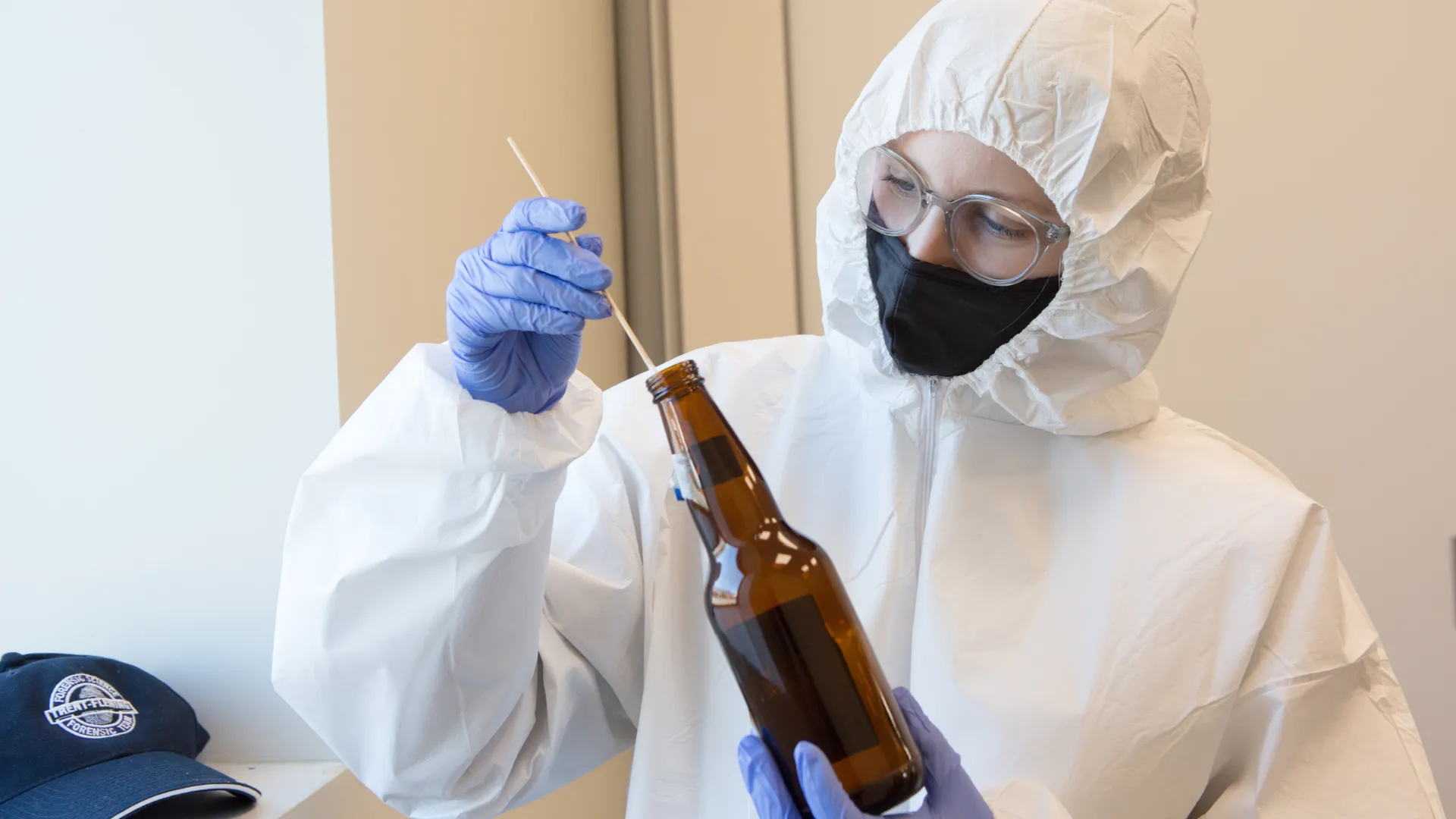 Trent Forensic student swabs a bottle
