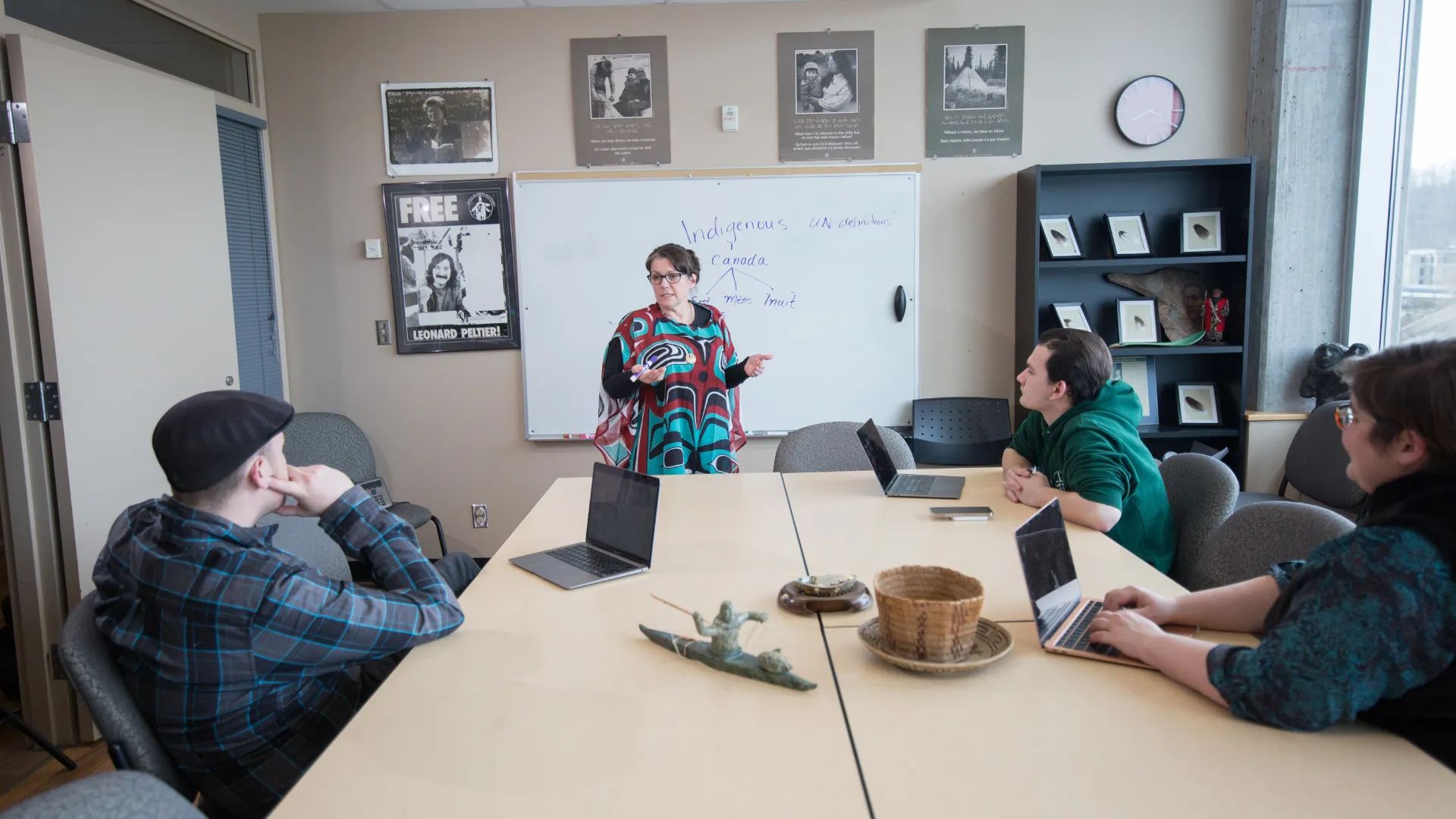 Trent students listen to a professor in a seminar room