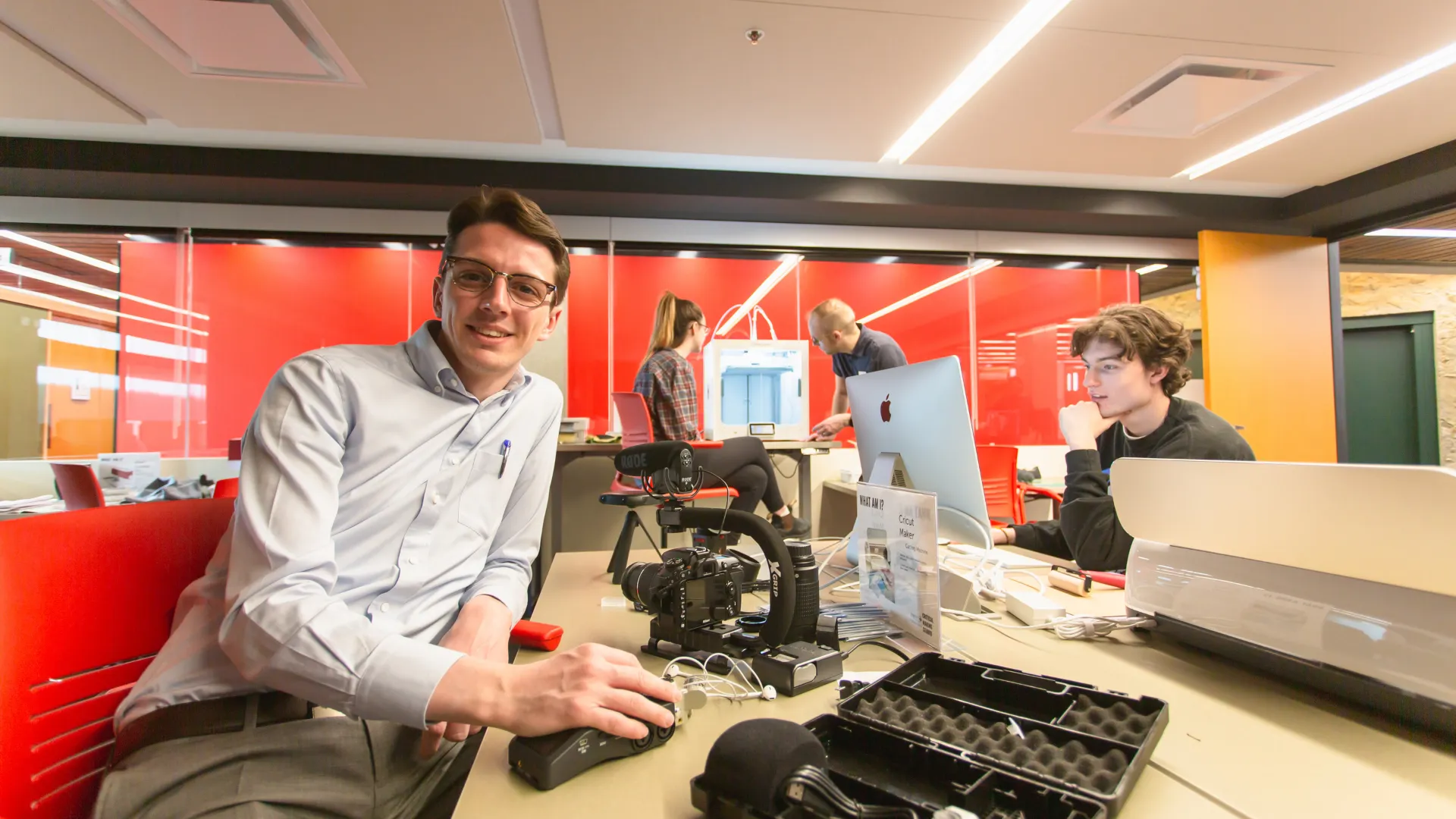 A Trent student poses for a photo with recording equipment