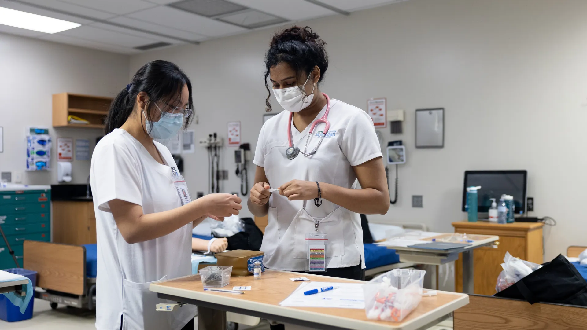 Trent students practicing with samples in a nursing lab