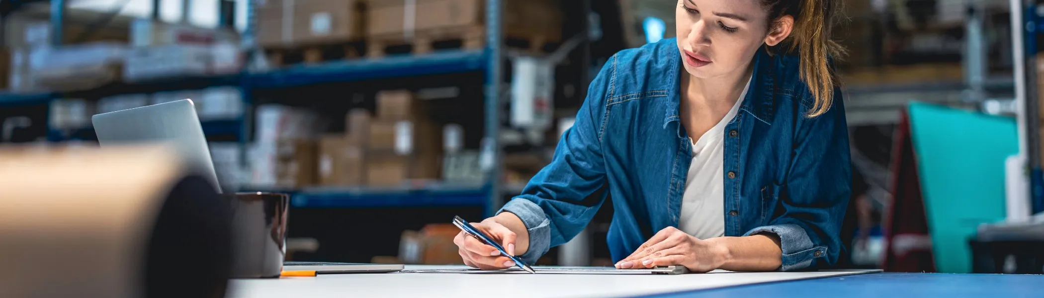 A woman working in a warehouse