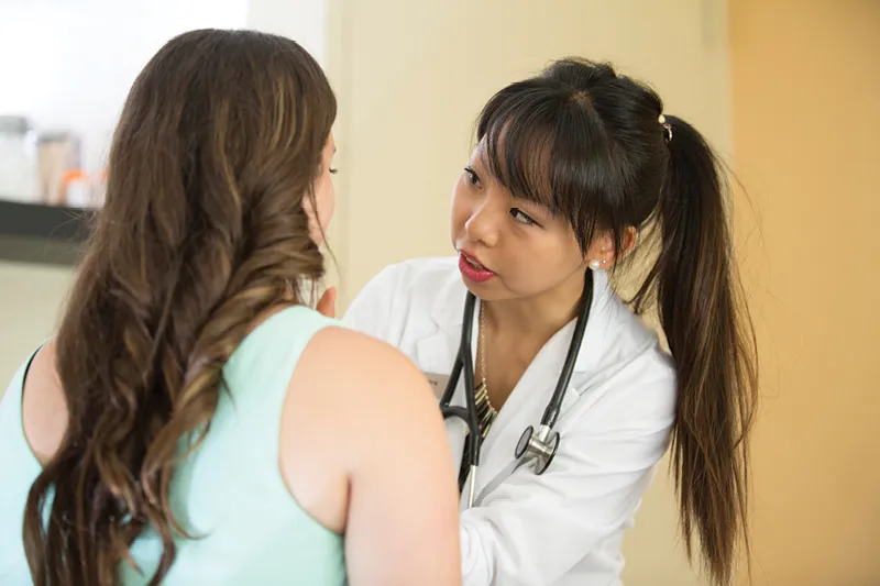 Naturopath with patient. Photo Courtesy of CCNM