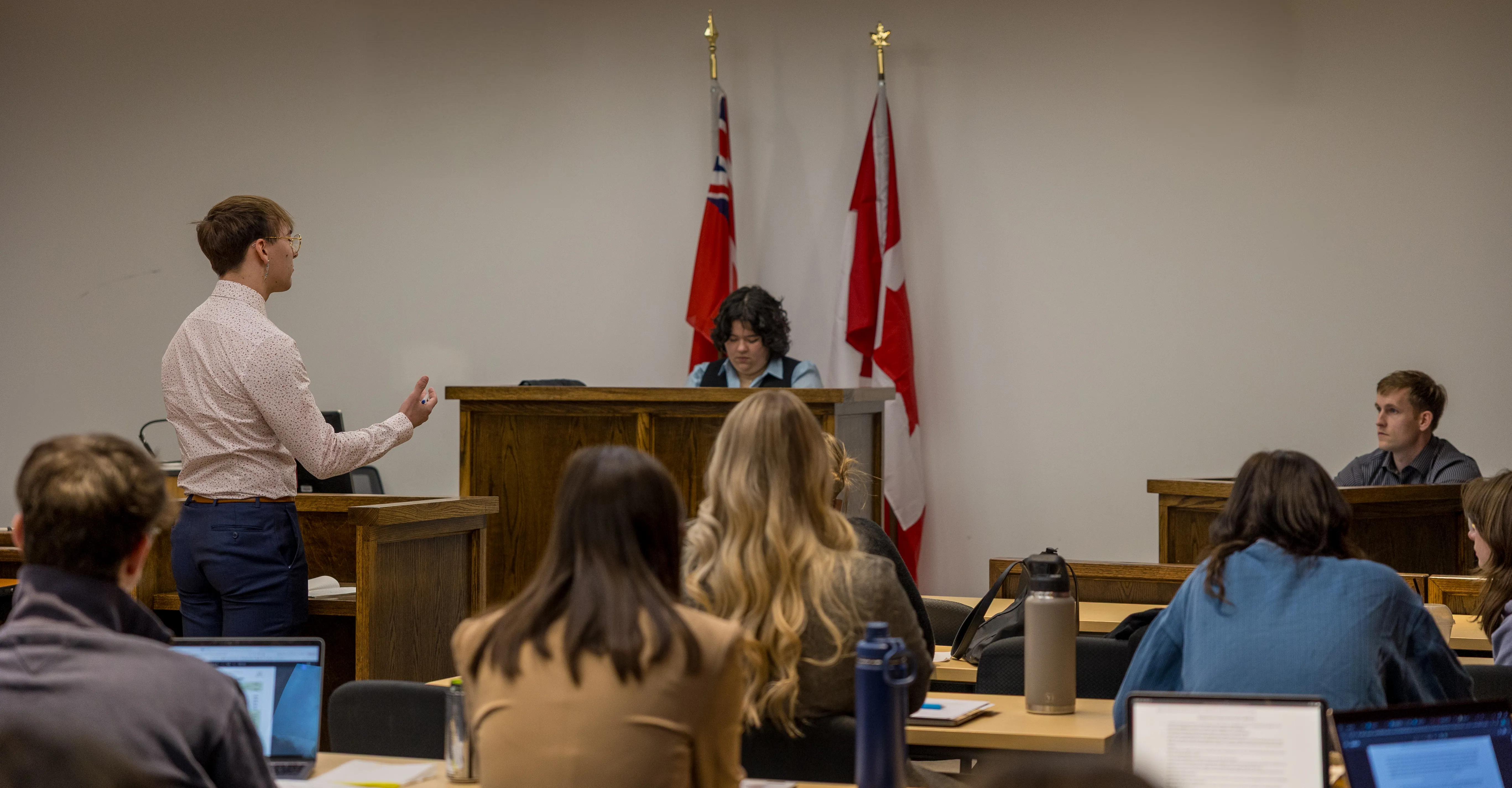 Law students in mock courtroom.