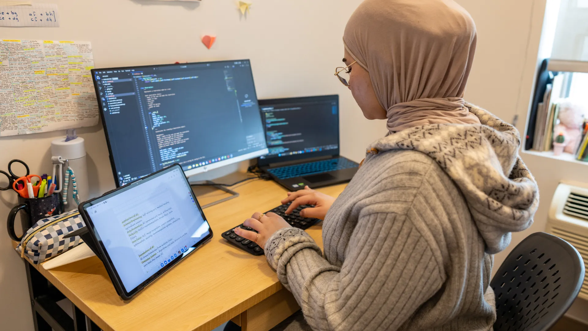 Student working on code in dorm.
