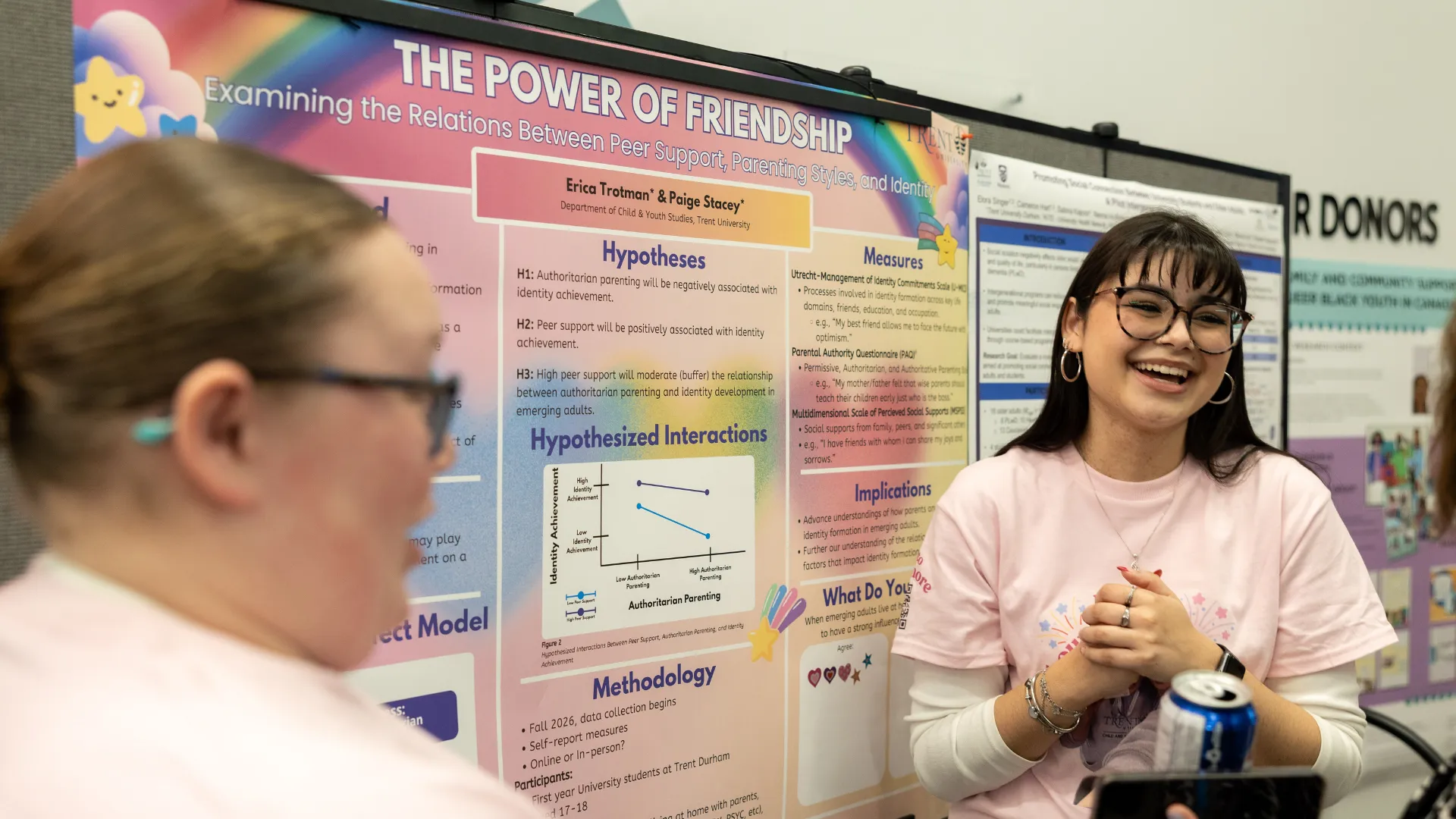 Student talking about their research poster.