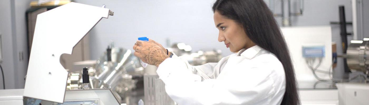 scientist inspecting equipment during an experiment