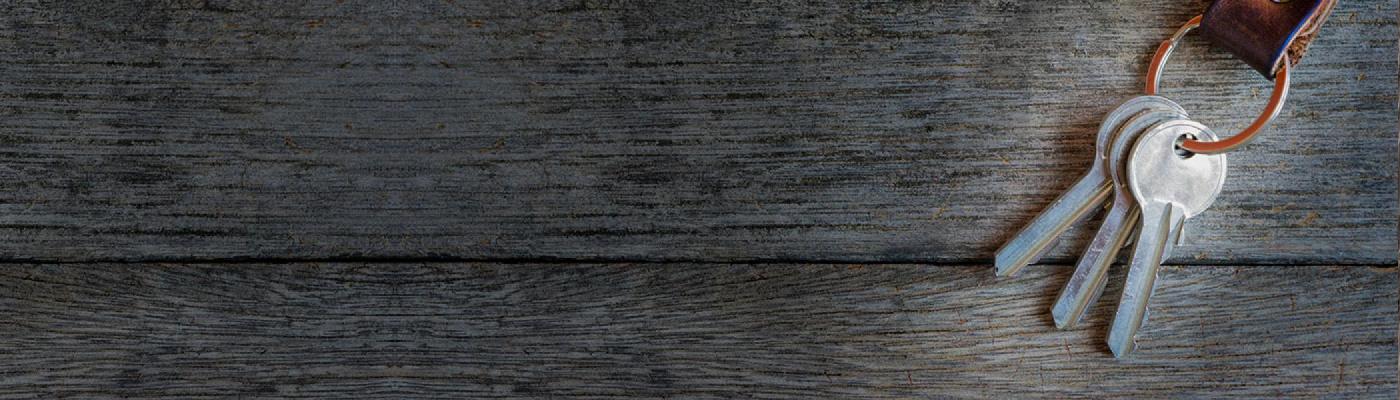 keys on a keychain on a wooden table