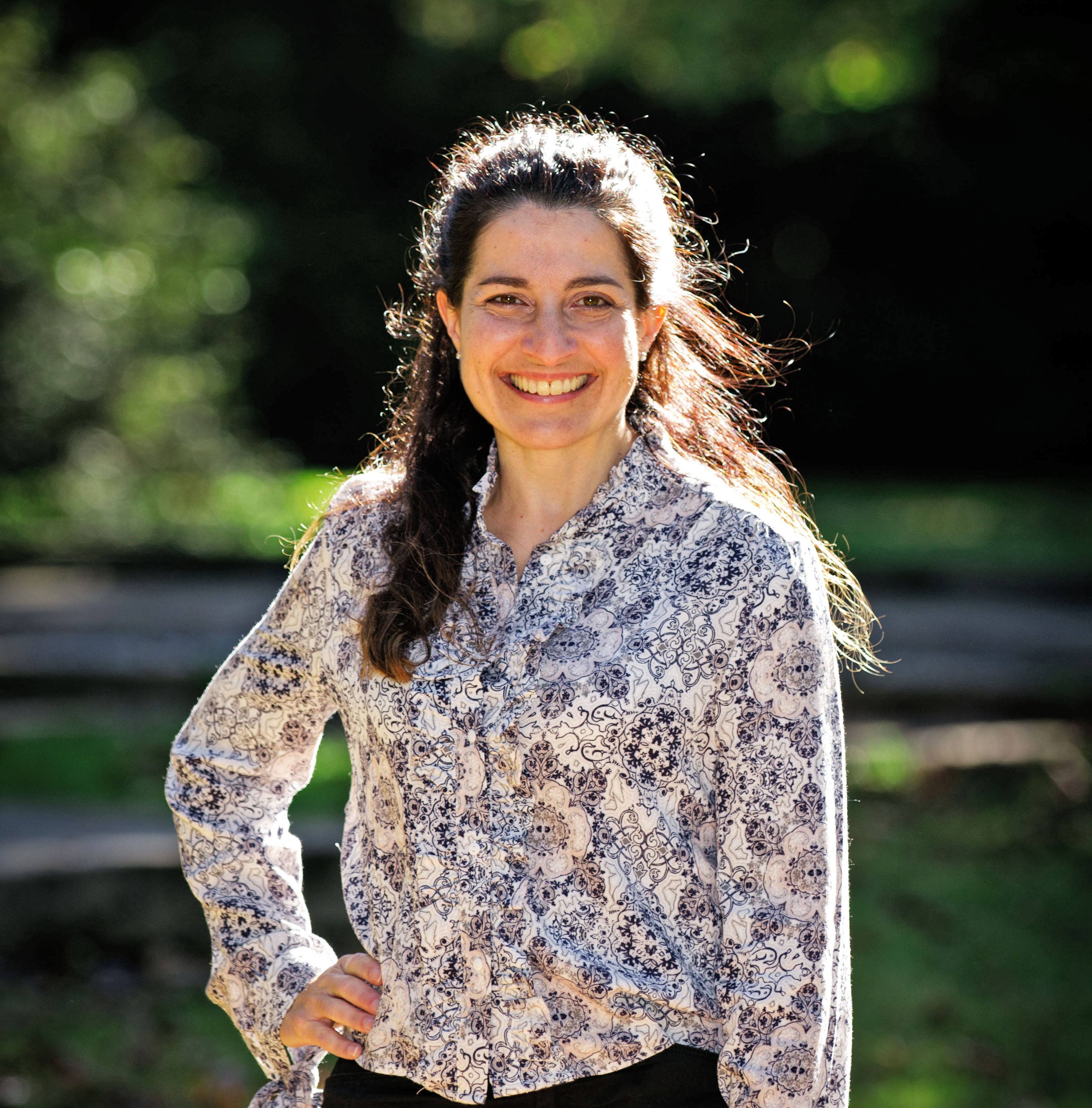 Smiling woman with patterned shirt