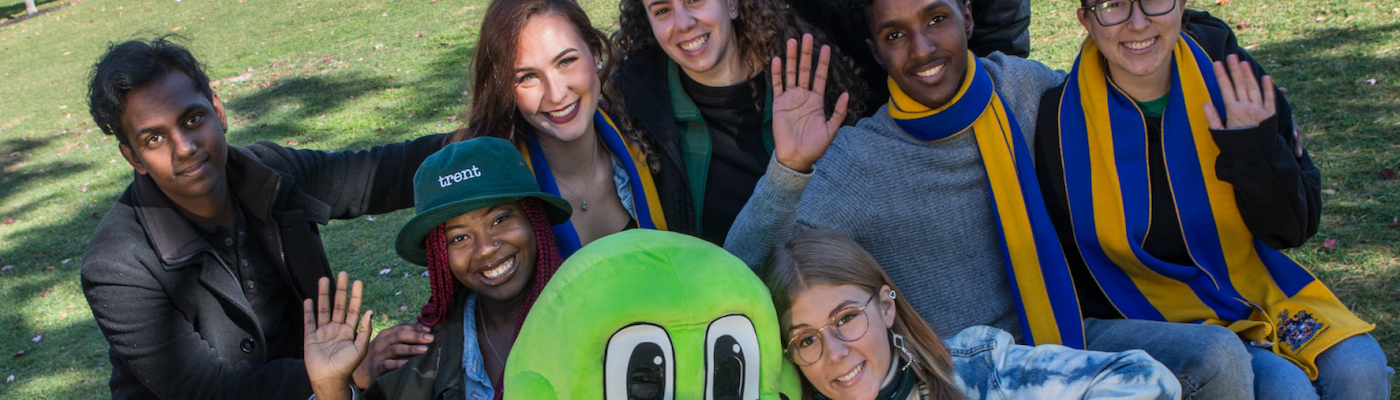 Students with toad mascot smiling 