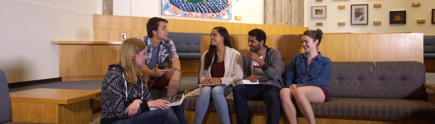 Students sitting talking and laughing 