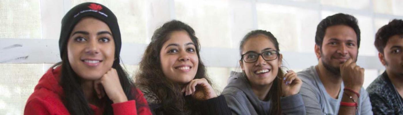 Five students sitting