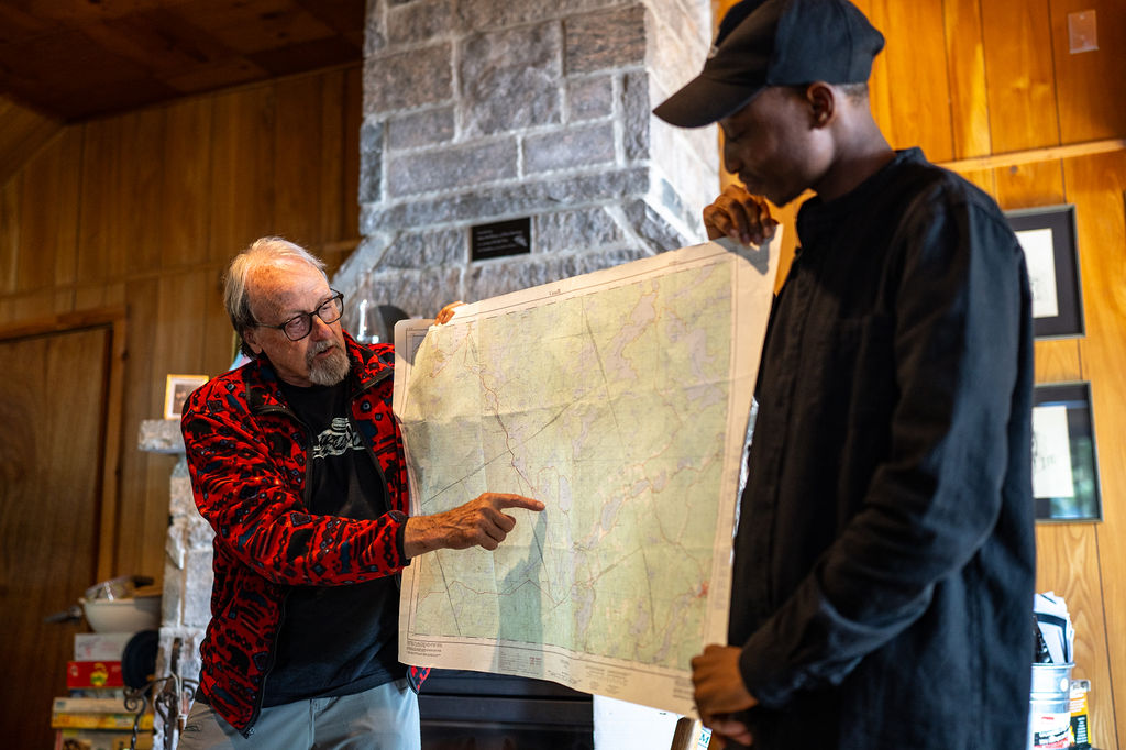 professor and student looking at a map
