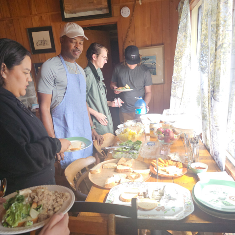students getting their group cooked meal