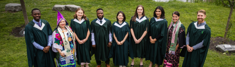 sustainability studies graduates posing for picture at convocation in gowns