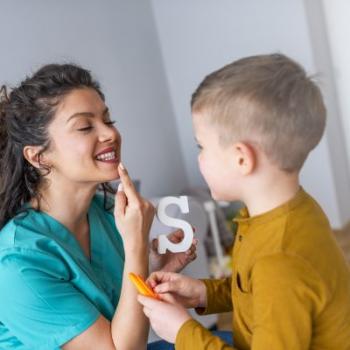 Speech Language Pathologist working with child