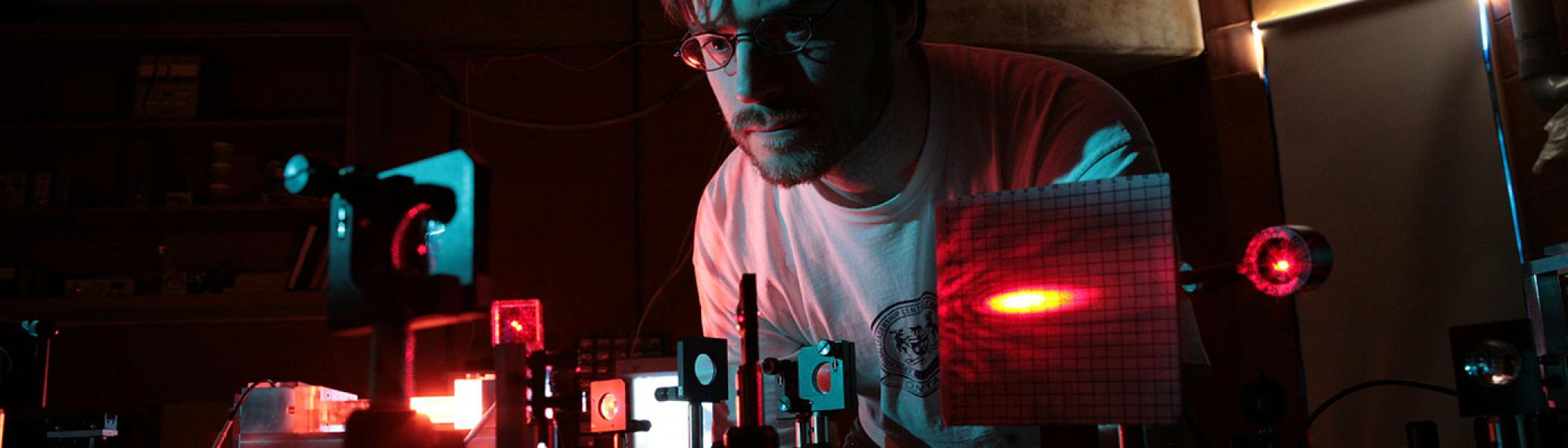 Student using lasers and other instruments in Trent's Centre for Materials Research