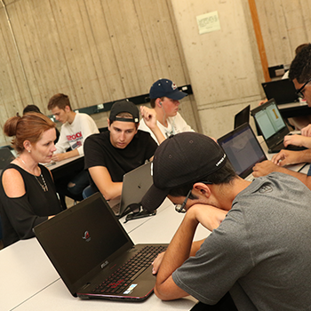 students working on their computers in a classroom