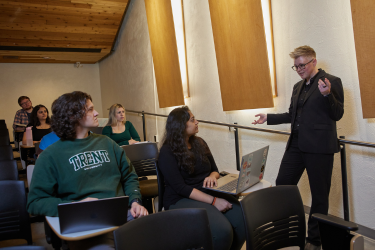 Professor conducting a lecture in a lecture hall