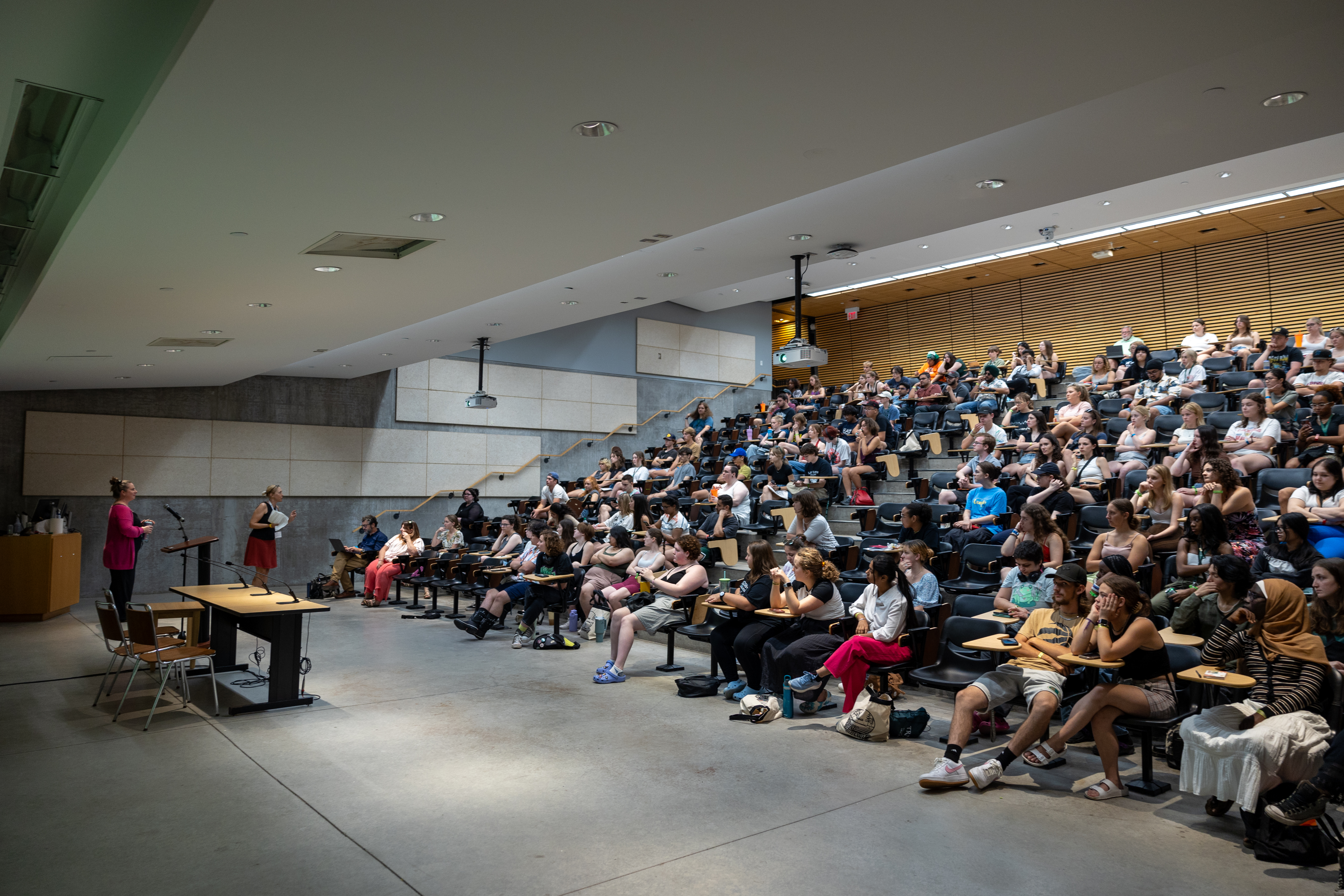 Students in a lecture hall receiving a lecture