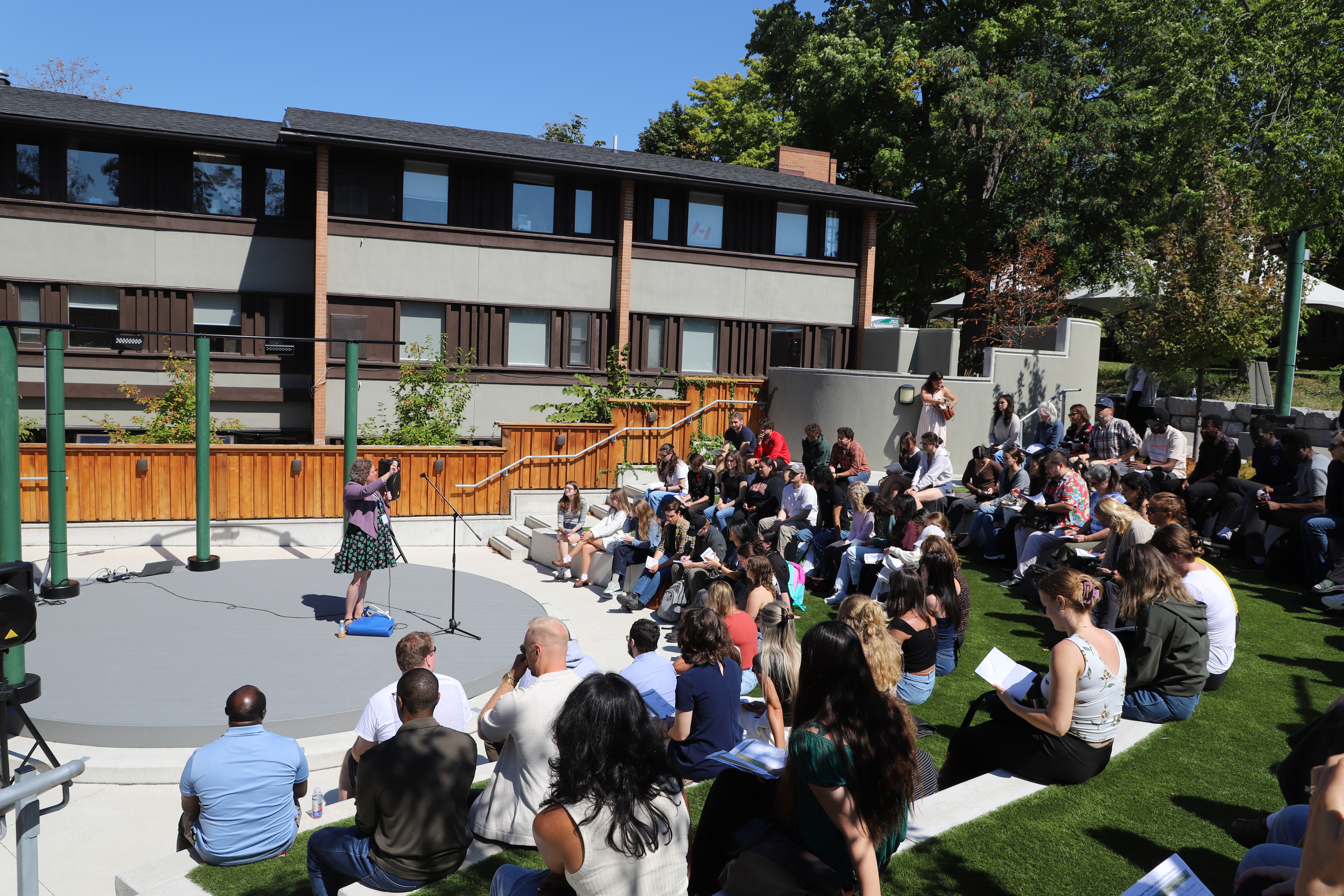 Dana Capell speaking to GTAs at the Traill College Amphitheatre 