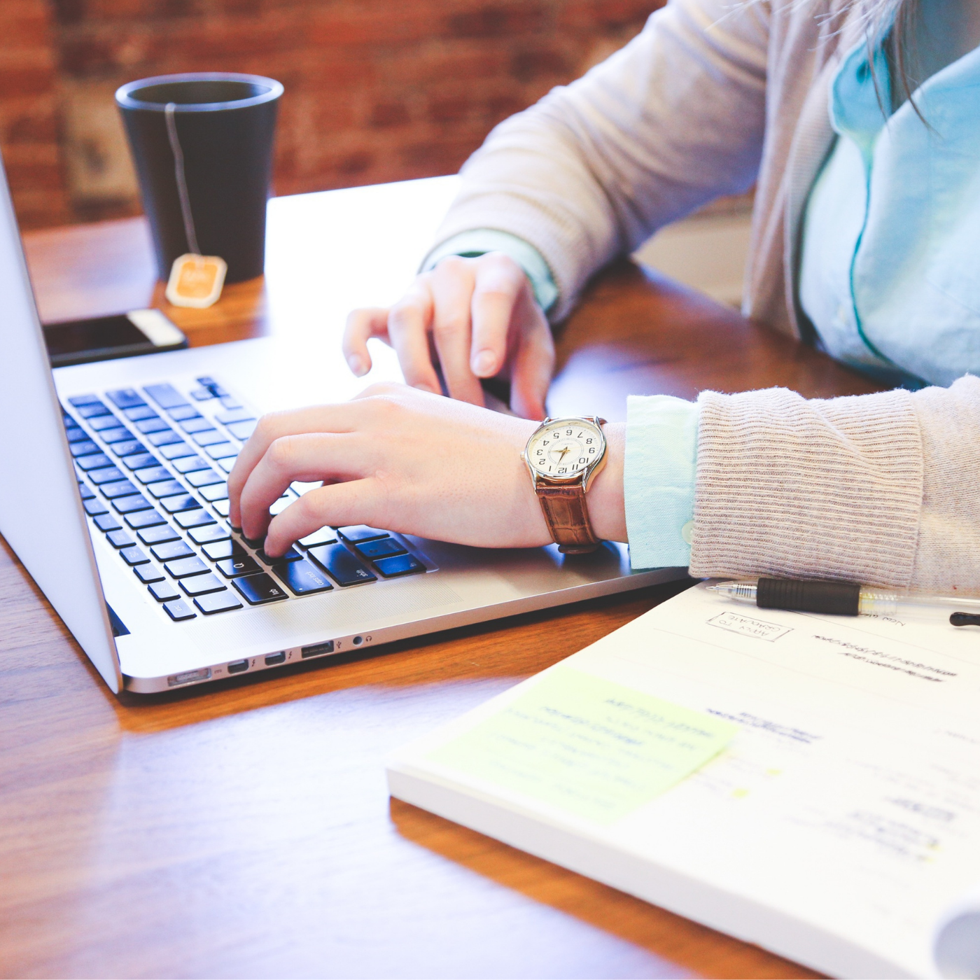open laptop with hands typing