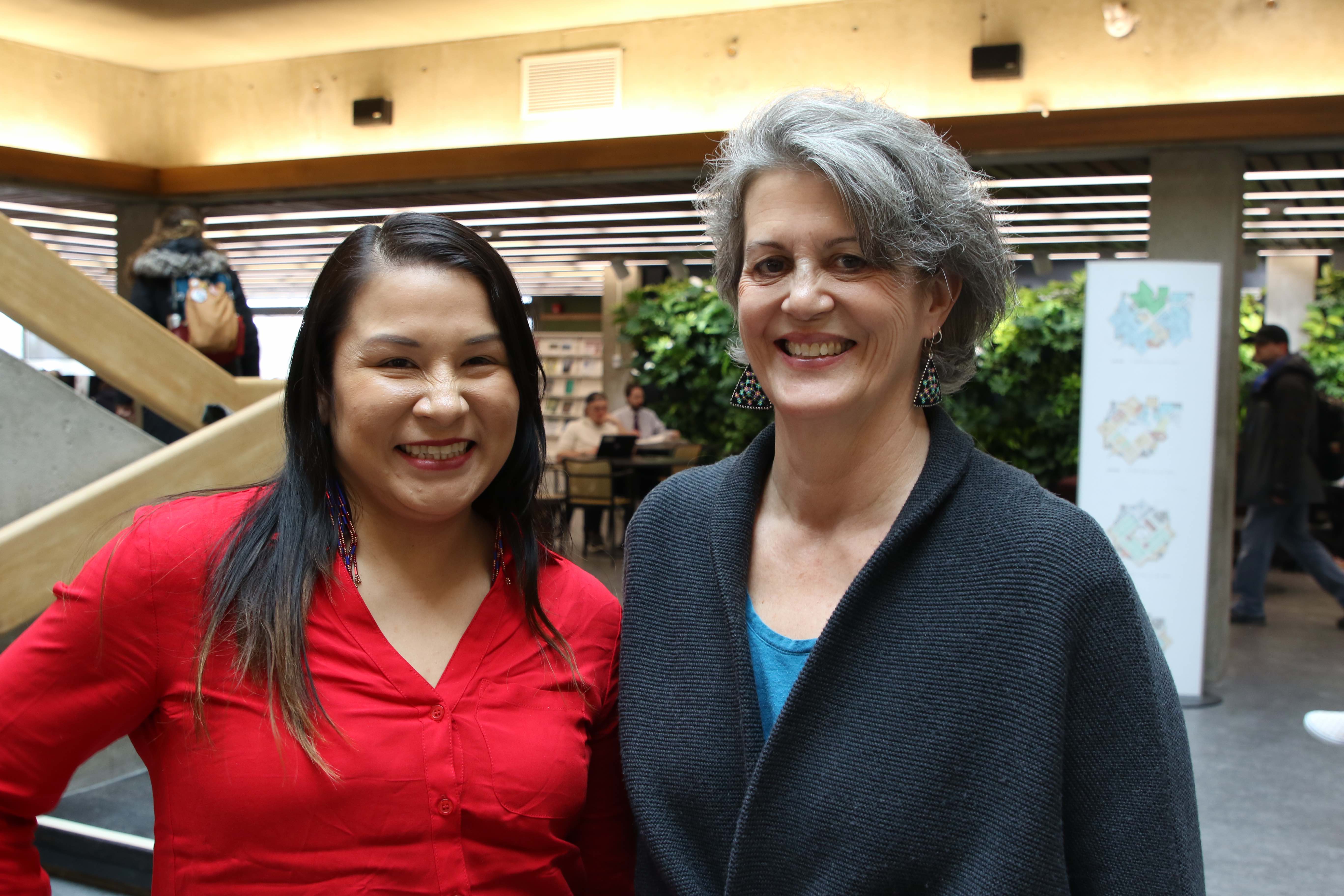 Barbara Wall and Amy Shawanda smiling in bata library