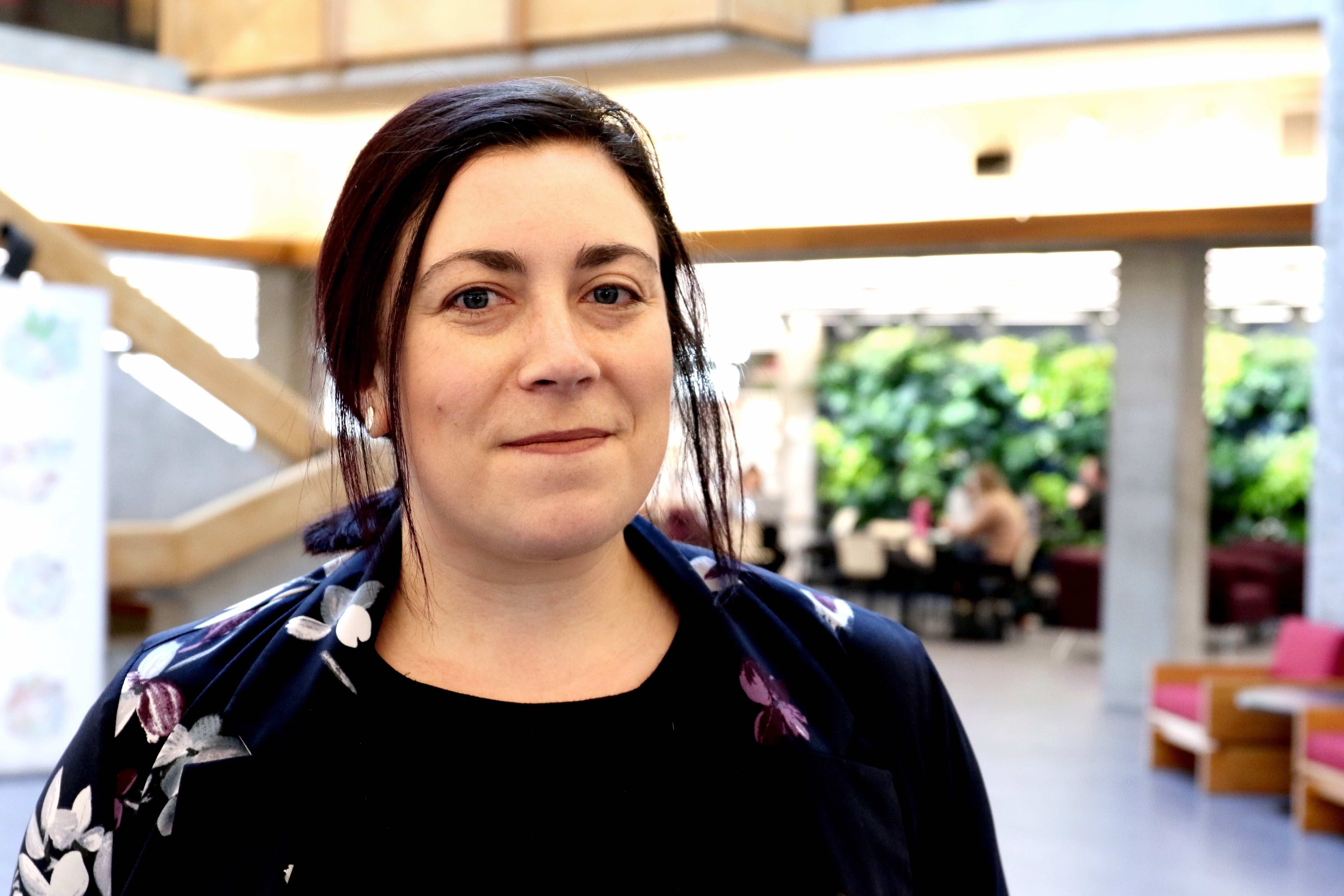 Theresa standing in Bata Library