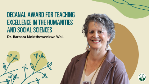 Barb Wall smiling on a poster for her award