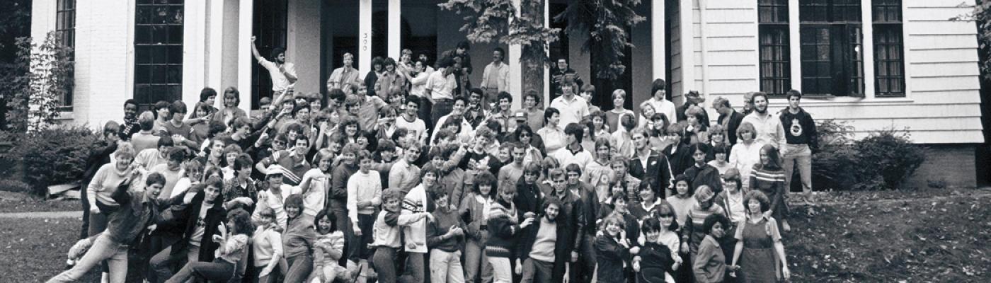Students standing in front on of Scott House on a summer's day