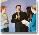A professor talking with students.