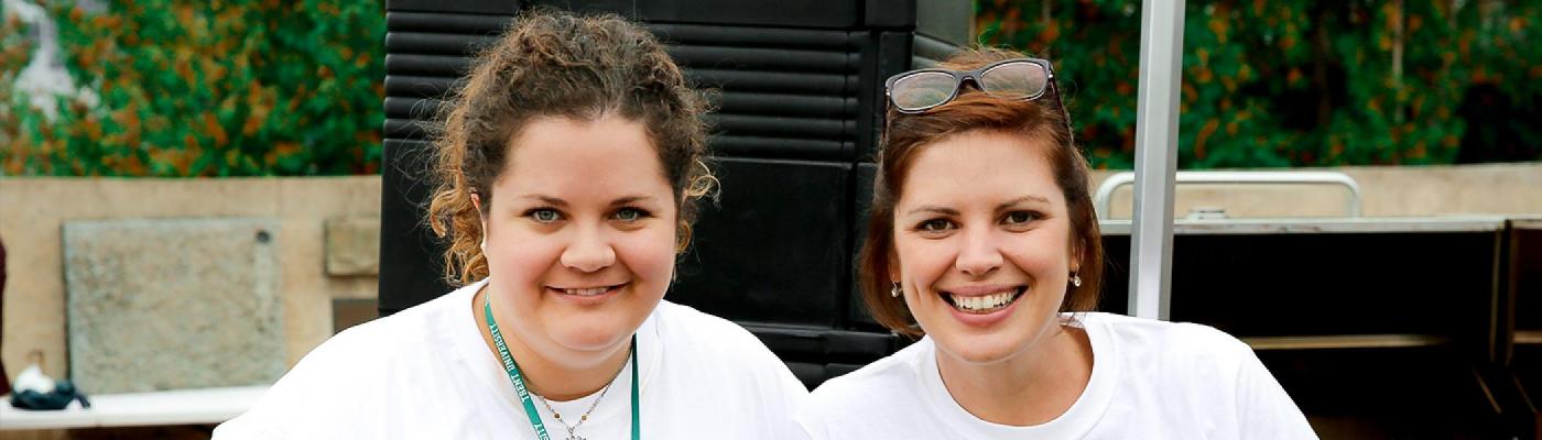 Two United way volunteers raising money at trent wearing united way t-shirts