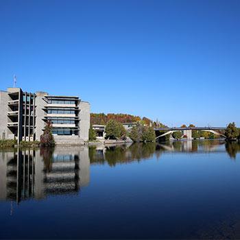 Bata library in the fall taken from across the Otonabee river.