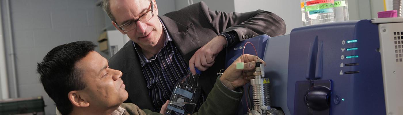 Dean Hintelmann with a graduate student in the lab