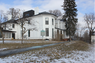 Image of a white building named Scott House on a grassy lawn.
