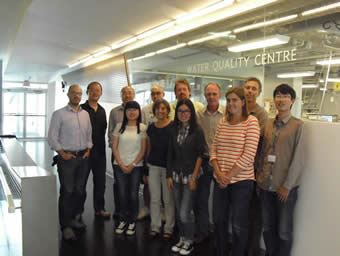 Graduate students and researchers pose for picture in front of Trent's Water Quality Centre.