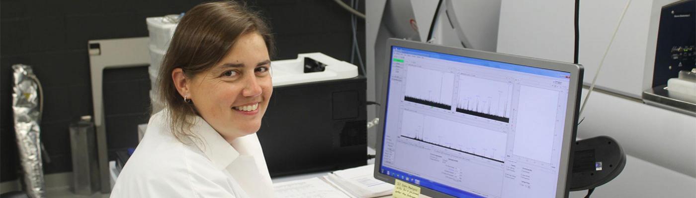 Scientist analyzing data collected from various instruments on a monitor